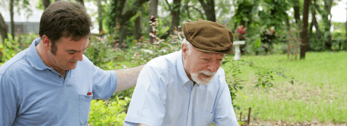 caregiver assisting patient in walking