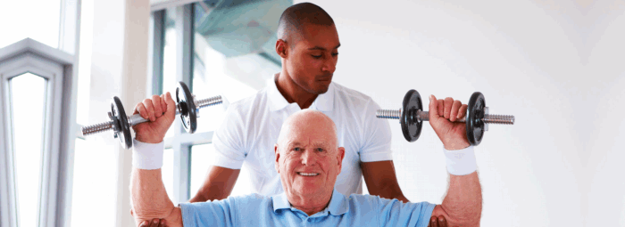 caregiver assisting patient in lifting weights